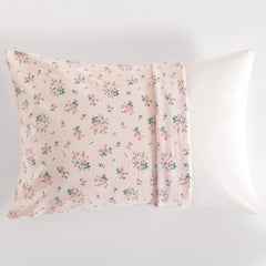 NTBAY pink floral pattern adds cute nursery decor to a crib or bed.