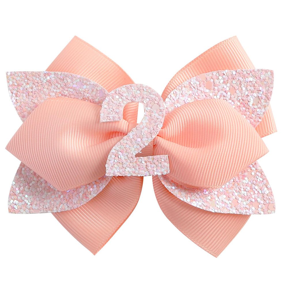 Nuolich glitter birthday bow peach adds festive sparkle to toddler hairstyles.