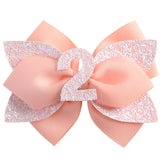 Nuolich glitter birthday bow peach adds festive sparkle to toddler hairstyles.