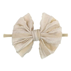 NUOSYI pink headband with large bow for cute daytime outfits.