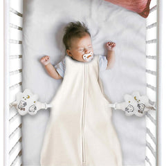 Nurturally baby anti-roll sleeper setup shows safe crib attachment for stable positioning.