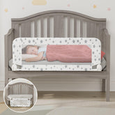 Nutikas crib rail guard attached to crib frame for secure, stay-put safety.