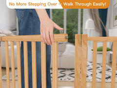 Oapety gate placed across a doorway, blocking stairs safely.