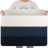 OIAHOMY 108L blanket basket in living room with easy-access storage.