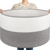 OIASKET blanket basket with handles in grey and white, ideal for easy living room organization.