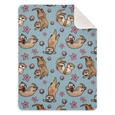 Ollabaky Otters blanket with vibrant print enhances nursery coziness.