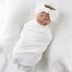 OMUKY soft swaddle fabric close-up, breathable and gentle.