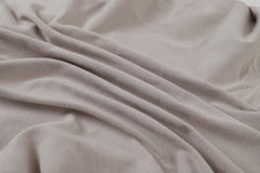 Onacosht bassinet sheets showing 360° elastic band for secure fit.