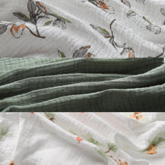 Breathable cotton muslin keeps baby comfortable during night sleep.