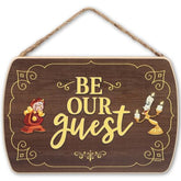 Open Road Brands Be Our Guest wood wall decor enhances entryways with classic Disney charm.