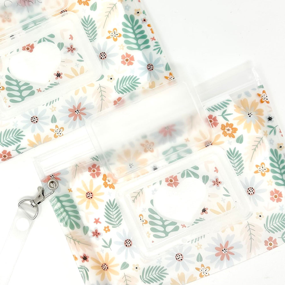 Orchid Hearts compact wipes dispenser for on-the-go diaper bag needs.