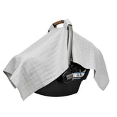 Organic Cotton Mart muslin car seat cover in gray shields sun and dust.