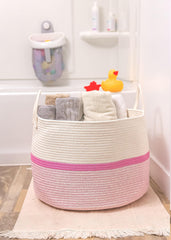 OrganiHaus pink stripe basket adds nursery storage with soft color.