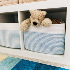 Blue/off-white basket adds minimalist style to shelves or bathrooms.