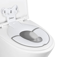 Orzbow foldable potty seat with suction cups securely attached to toilet lid.