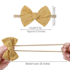 Ovenot Baby Bow Headband mint green stripes, enhances outfits and remains comfortable all day.