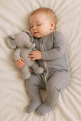 Owlivia newborn footed sleeper from the three-pack, cozy and snug for naps and sleep.