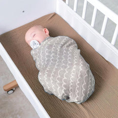 Owlowla two-pack muslin covers in natural tones for versatile nursery use.