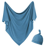 OWLOWLA newborn swaddle blanket in peacock color for cozy swaddling and peaceful naps.
