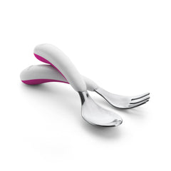 OXO Tot Training Fork & Spoon Set in pink, side view highlighting ergonomic grip