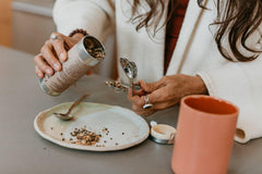 PAAVANI Ayurveda tea ingredients bowl highlighting organic botanicals for support
