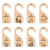 PAMBO Winnie Bear closet divider organizes baby outfits in a tidy nursery.