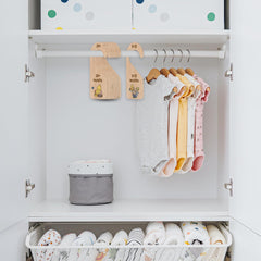 PAMBO Winnie Bear newborn essentials stored neatly for quick outfit changes.