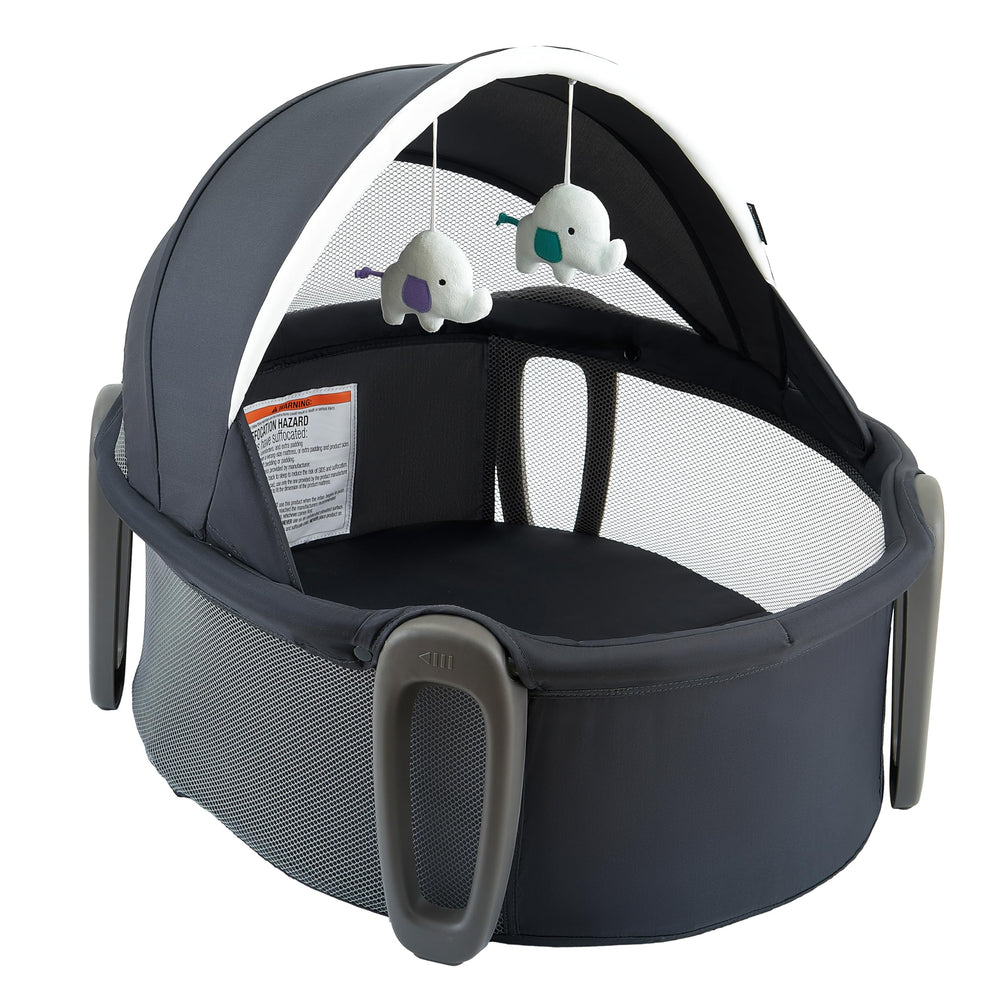Pamo Babe Portable Bassinet Dome creating a cozy sleep space on the go.