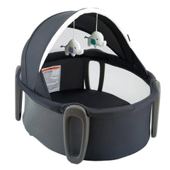 Pamo Babe Portable Bassinet Dome creating a cozy sleep space on the go.