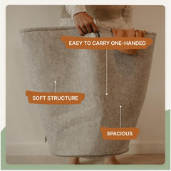 Parker Baby Co. collapsible hamper in white, folds flat for compact storage.