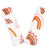 Pea Pod rainbow strap cover on car seat shows soft, skin-friendly comfort.