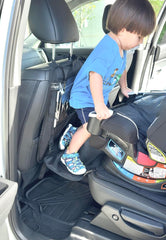 Peace of Mind Steppy car-seat access step helping a child climb into a parked car seat