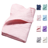 PEACELOVER embossed neutral baby quilt in pink adds gentle warmth and nursery style.