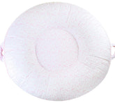 Pello multi-use baby floor pillow with soft center and raised sides for secure lounging