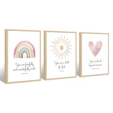 Pennclys boho nursery wall art heart with rainbow enhances cozy play area.