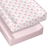 Peryiter pink bow changing pad cover fitting securely on a 32 x 16 pad