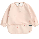 PewinGo baby bib with long sleeves in pink protects outfits during feeding