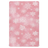 Pfrewn Christmas crib sheet with pink retro snowflakes on a mini crib for cozy naps