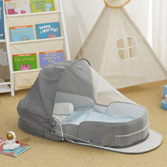 PGONEEE baby travel bassinet open with baby resting in travel-ready space.