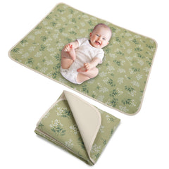 PHOEBUS BABY double-sided changing pad offers soft muslin top and easy-clean leather back.