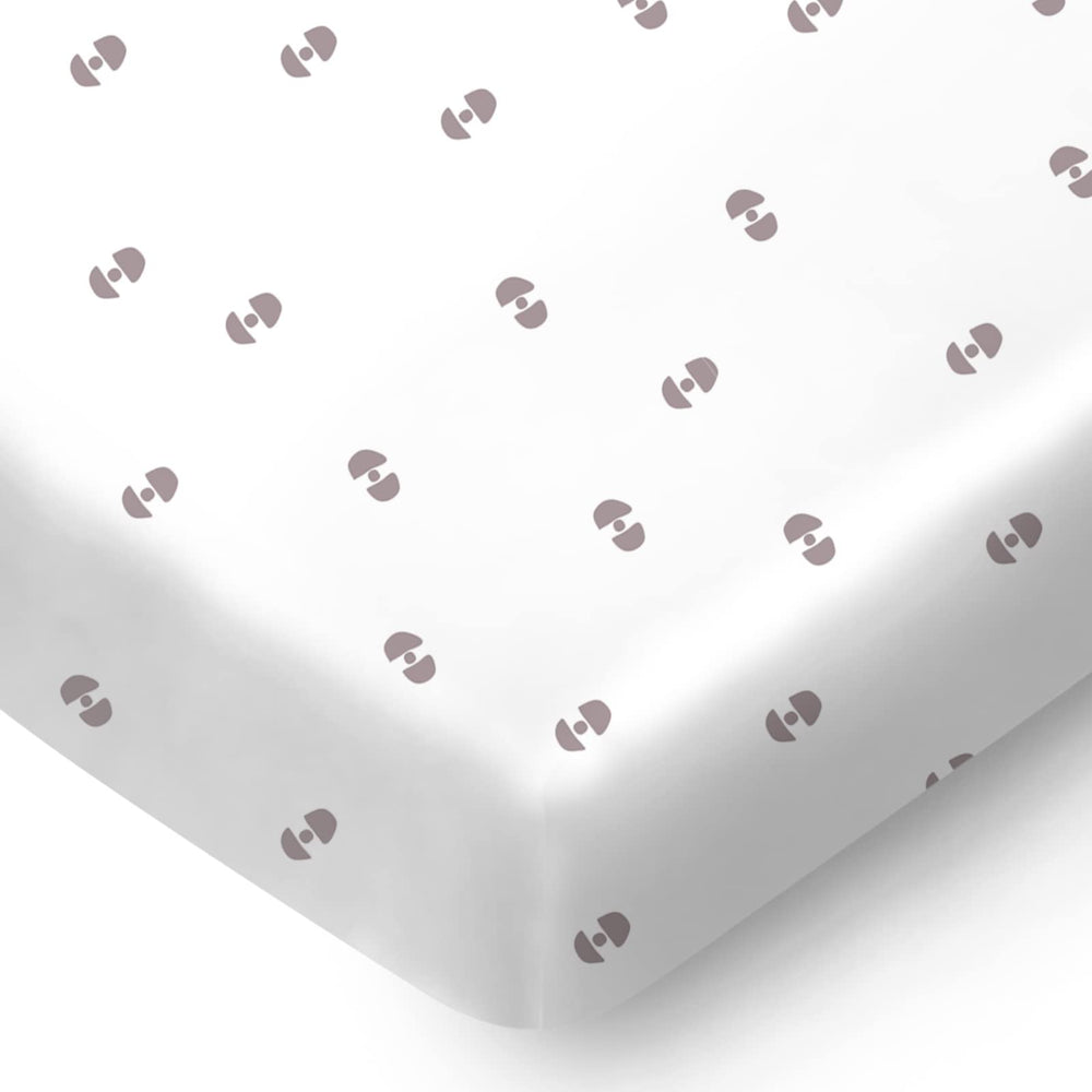 Pickle & Pumpkin mini crib sheet with geometric pattern, soft organic cotton for a cozy nursery.