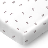 Pickle & Pumpkin mini crib sheet with geometric pattern, soft organic cotton for a cozy nursery.