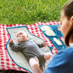 Pillani changing pad folded into a compact clutch for easy travel storage