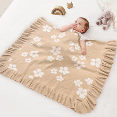 Pinuotu baby blanket in crib use for cozy, lightweight coverage.
