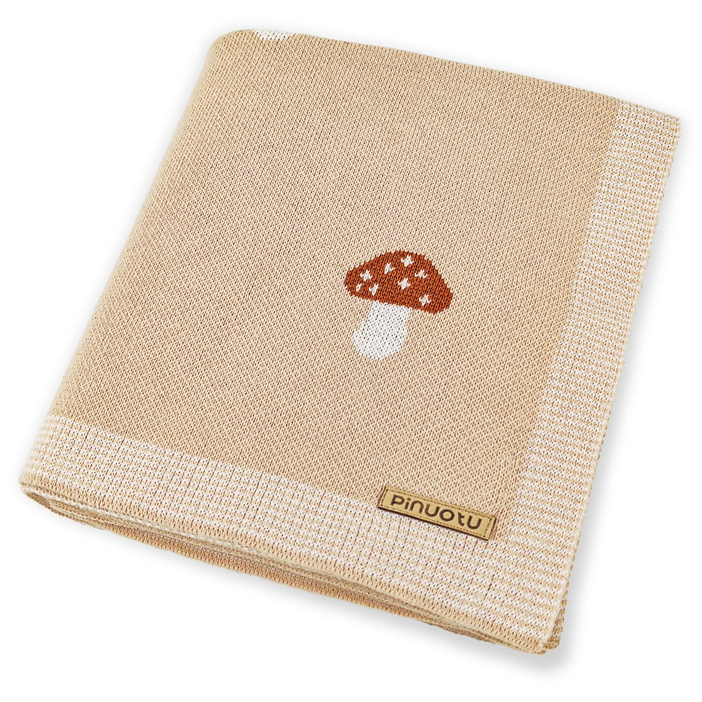 Pinuotu Mushroom Baby Blanket cream close-up knit texture for gentle skin contact.