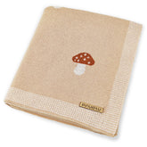 Pinuotu Mushroom Baby Blanket cream close-up knit texture for gentle skin contact.