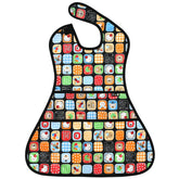Plie full-coverage bib on a toddler at a high chair keeps clothes clean during meals.