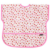 Plie short sleeve bib pink strawberry closeup shows waterproof fabric for mess-free meals.