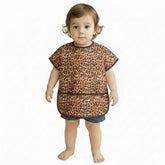 Plie short sleeve bib in brown leopard provides full mealtime coverage.