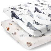 Pobibaby ocean pattern n-play sheet on mattress offers snug fit for safe sleep.